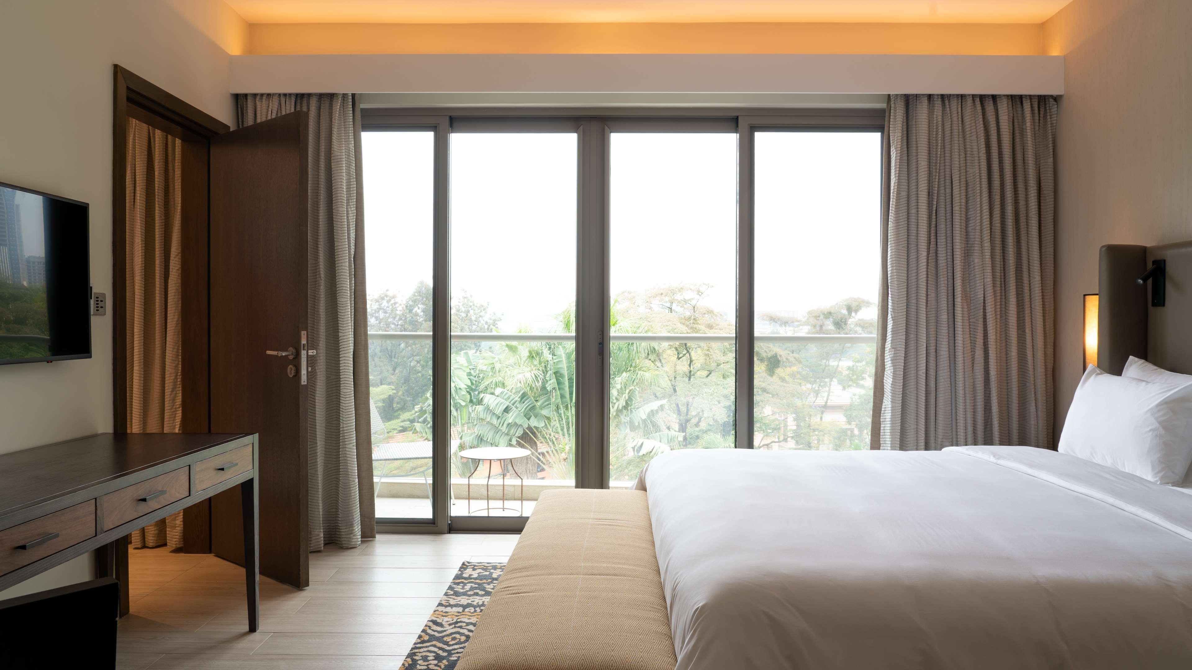 Radisson Blu Hotel & Residence Nairobi Arboretum Exterior photo A bedroom at the hotel